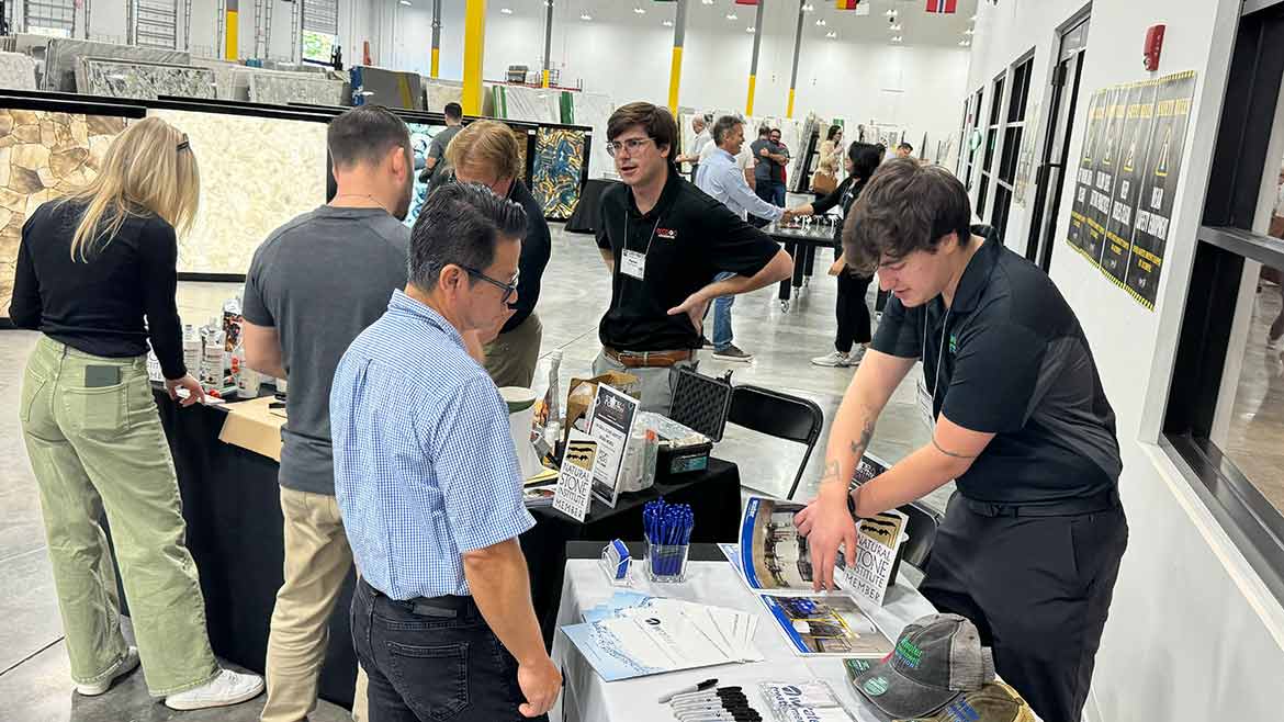 Attendees at Florida Stone Summit talking with sponsors